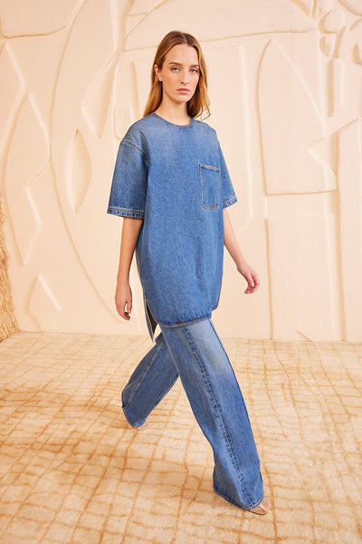 Danube Blue Denim Joan Tunic Dress Styled as Top Over Wide-Leg Jeans - Front View | Ulla Johnson