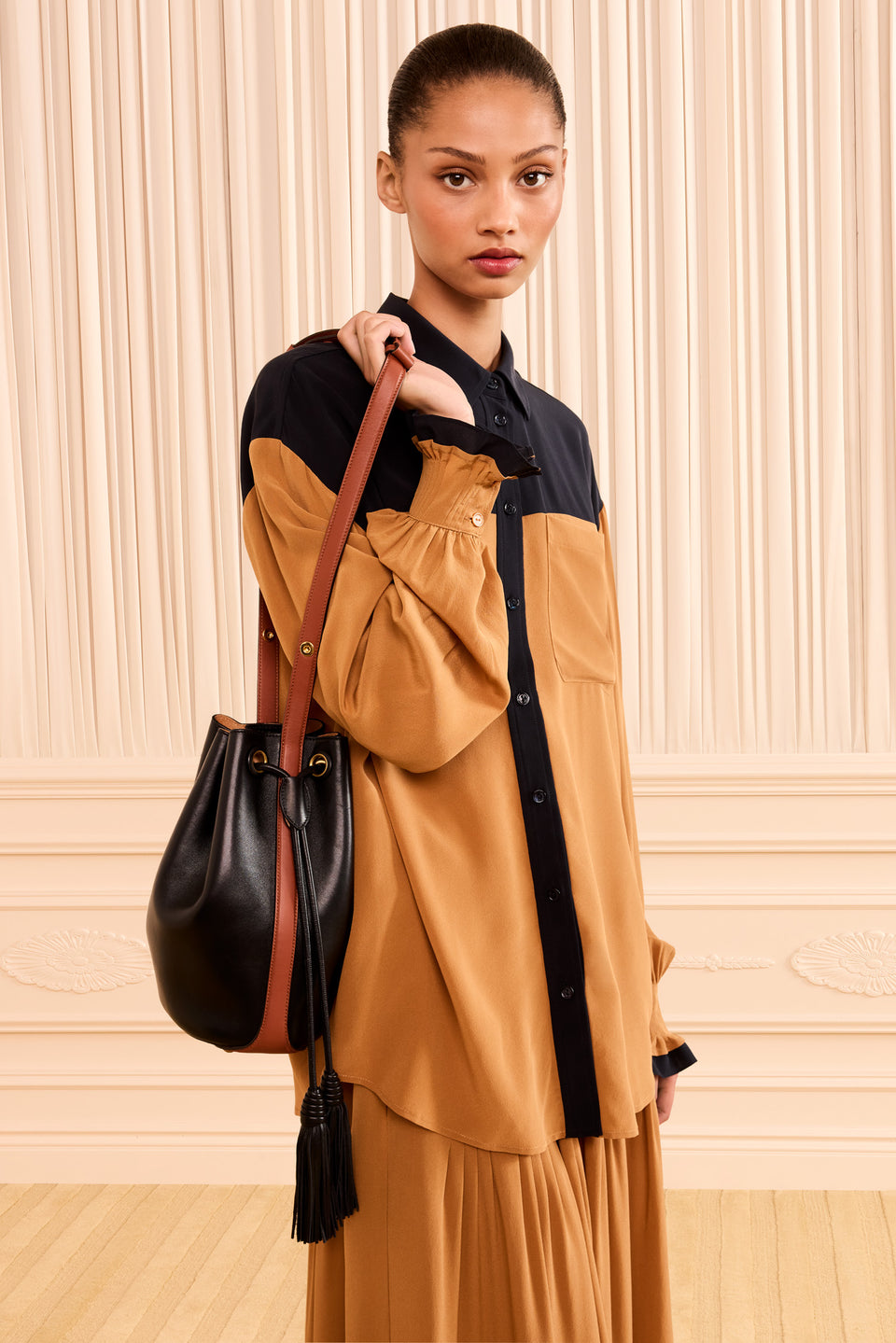 Luxury Black Leather Bucket Bag Worn On Model, Shoulder Carry - Drew Bag | Ulla Johnson