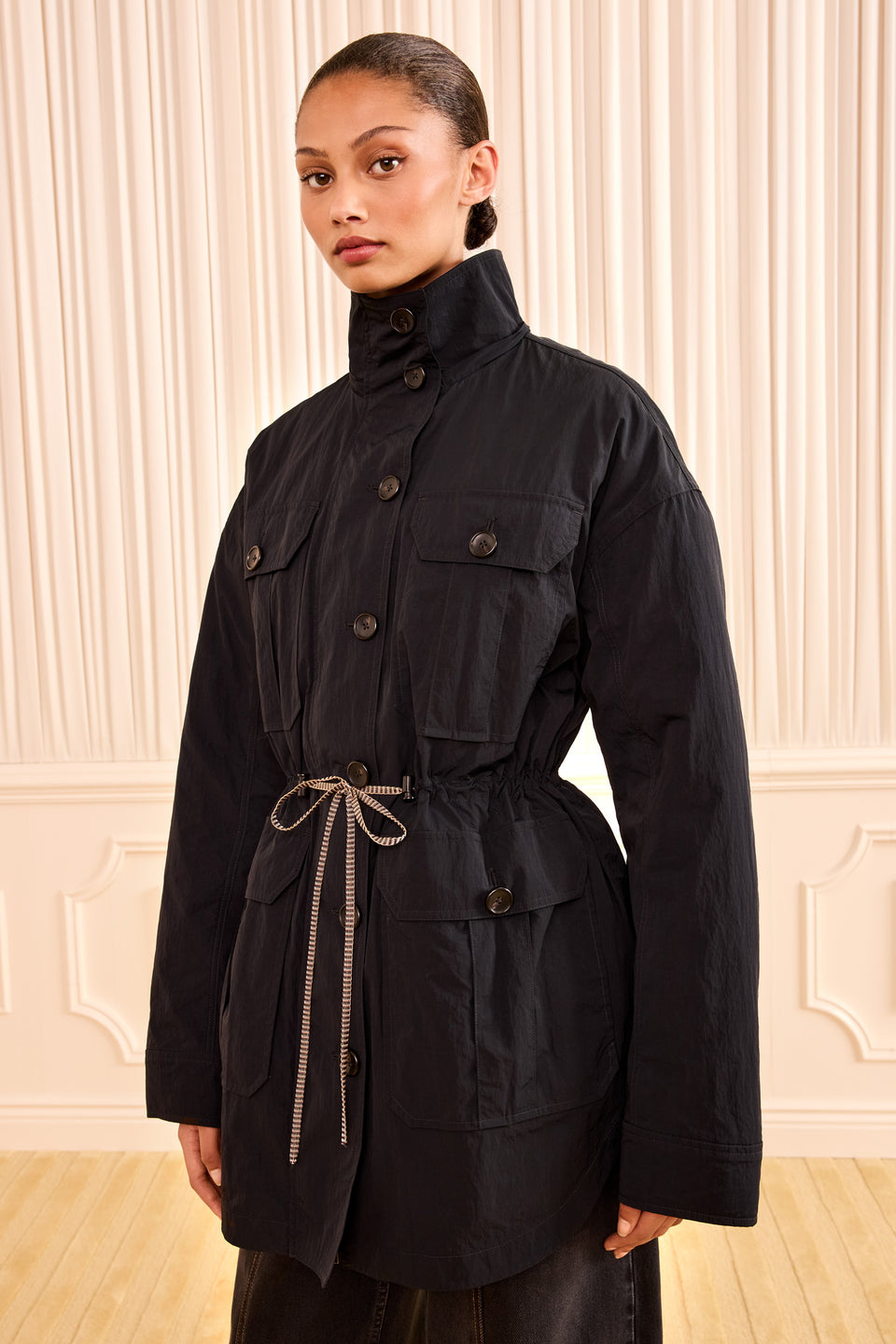 Noir Nylon Jacket with Hood Down, Self-Tie Waist - Three-Quarter View on Model | Ulla Johnson